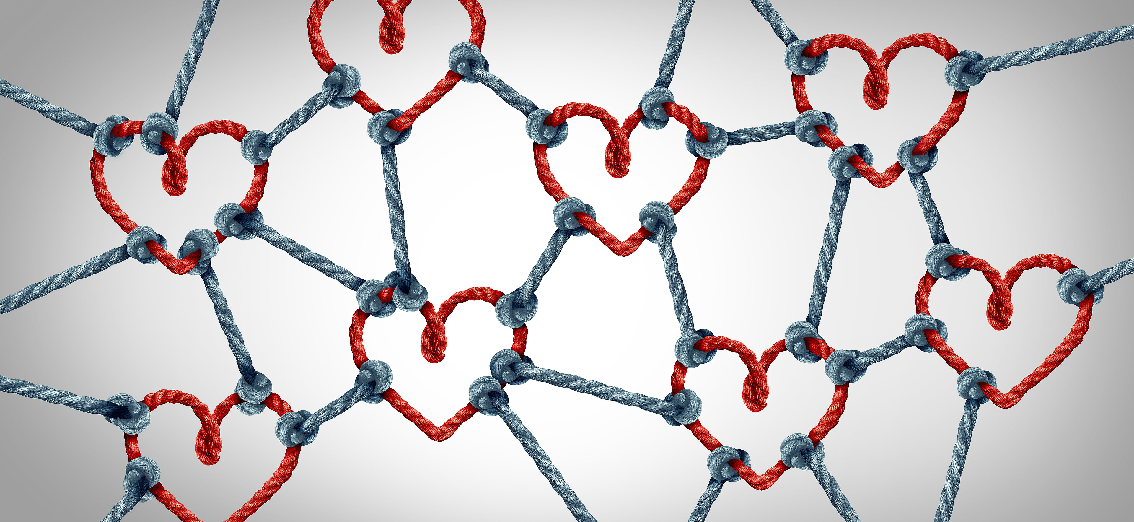 Blaue Seile verbinden rote Herzen miteinander als Zeichen des Zusammenhalts